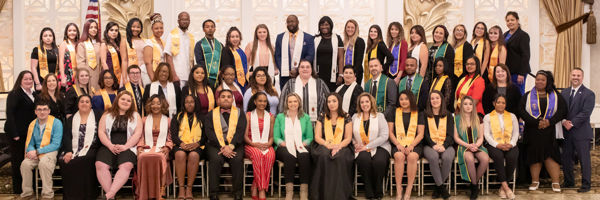 Group of students with stoles from Honors Induction ceremony