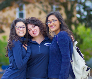 3 Female students smiling mobile image