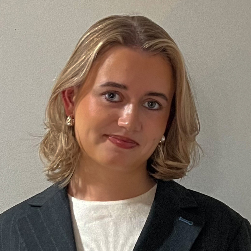 Berkeley honoree Emilia Hansson wears a white shirt and gray suit jacket