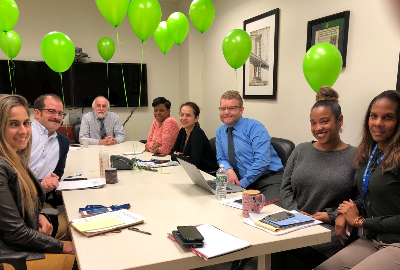 Michael Iris, Associate Vice President, Career Services and Alumni Relations (third from right), visits the Executive Committee Meeting in Brooklyn to share news about the Innovation Task Force
