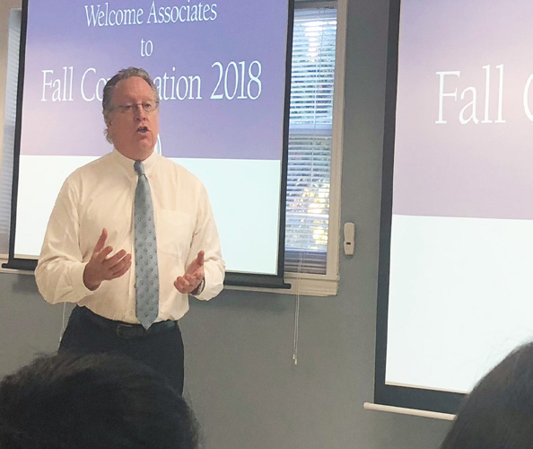 President Michael J. Smith addresses faculty and staff in Woodland Park
