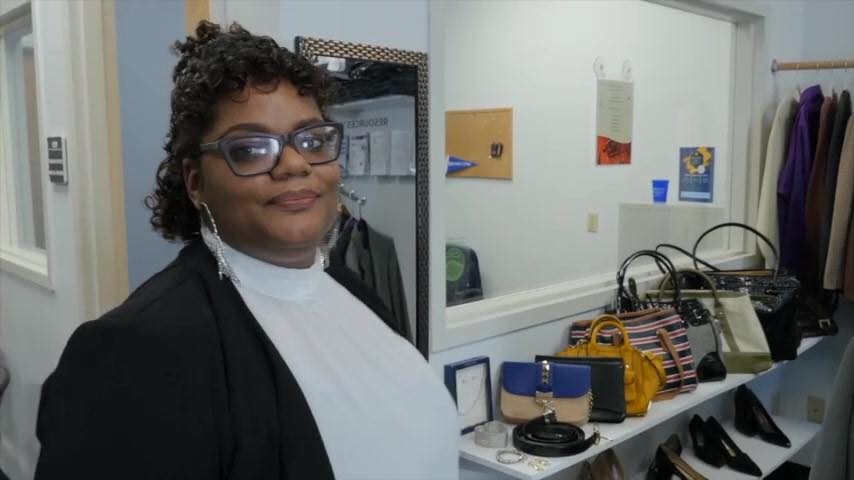 Berkeley College Student Nadirah Rhodes standing in front of Career Closet in Newark