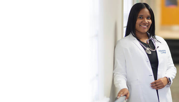 Berkeley Collage nursing student in white scrubs 