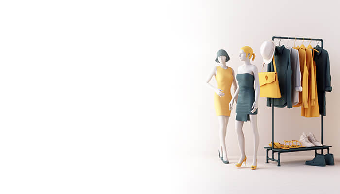 Two stylish mannequins in vibrant outfits stand next to a rack of fashion clothing and accessories in a minimalist setting.