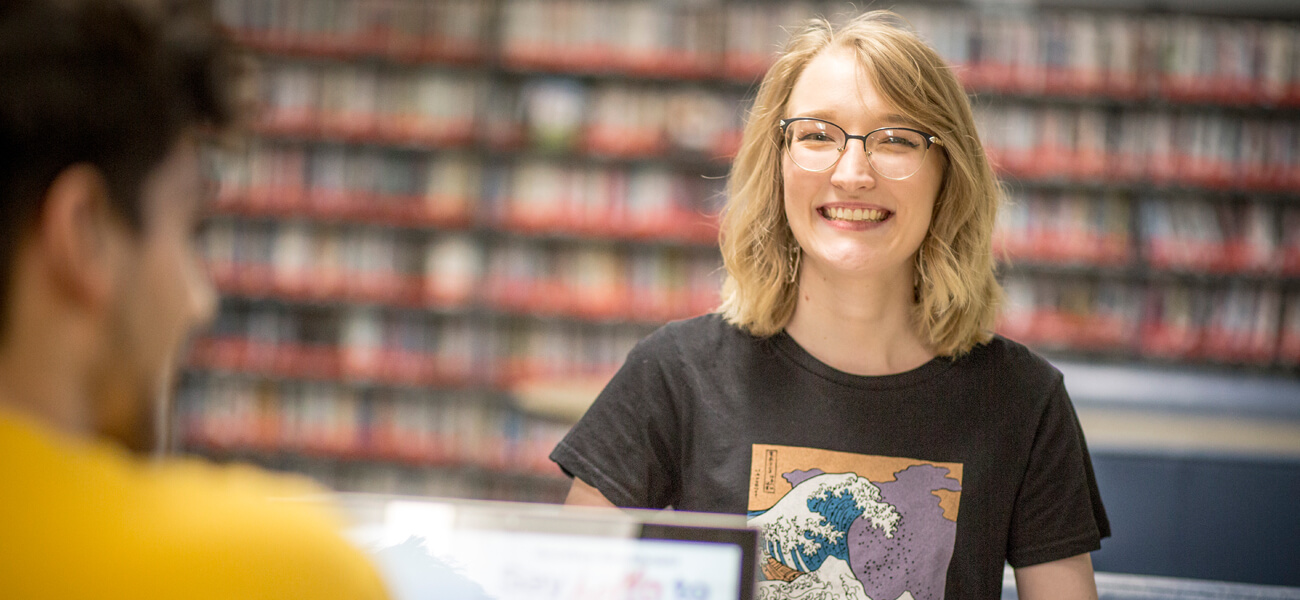 berkeley student smiling in the library