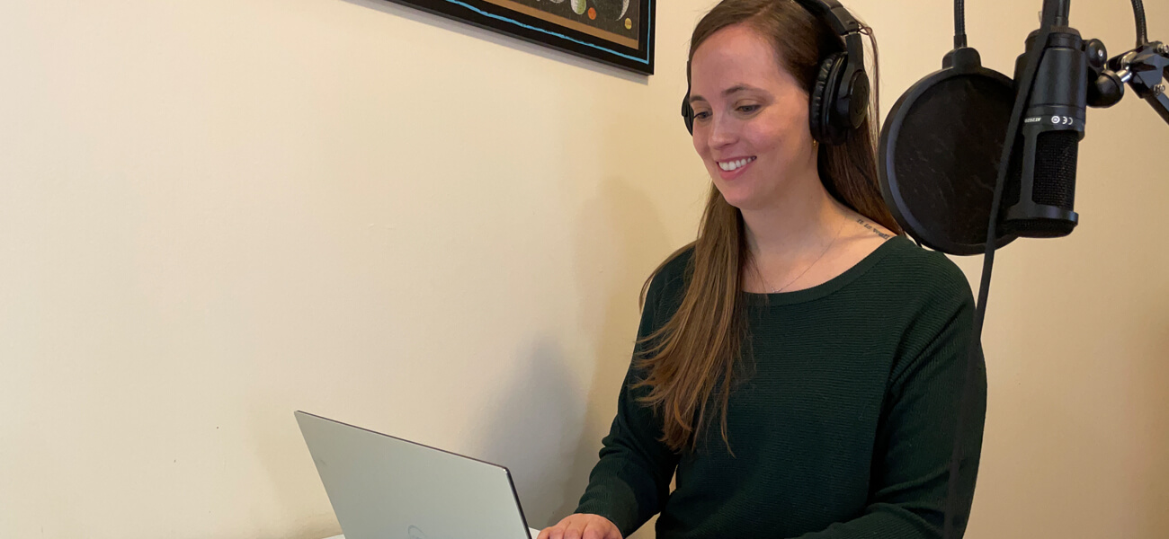 Sarah on her computer while recording a podcast