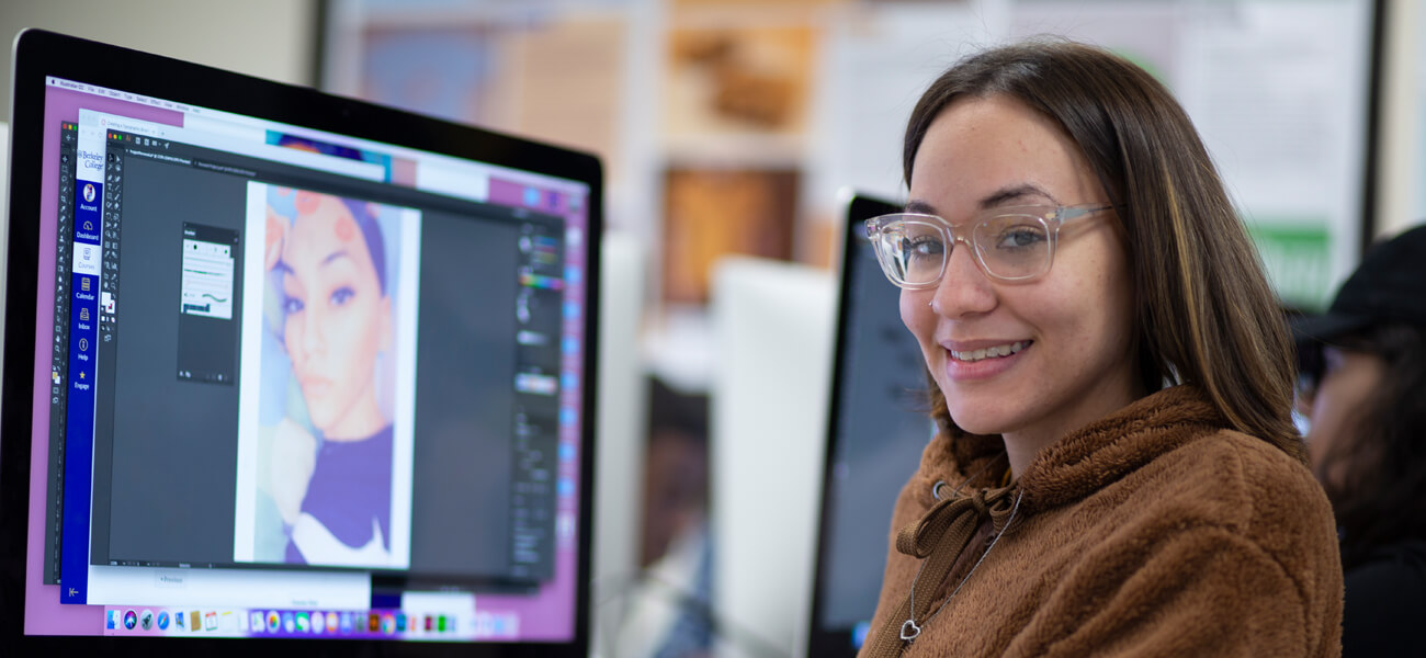 Graphic Design student working in front of computer