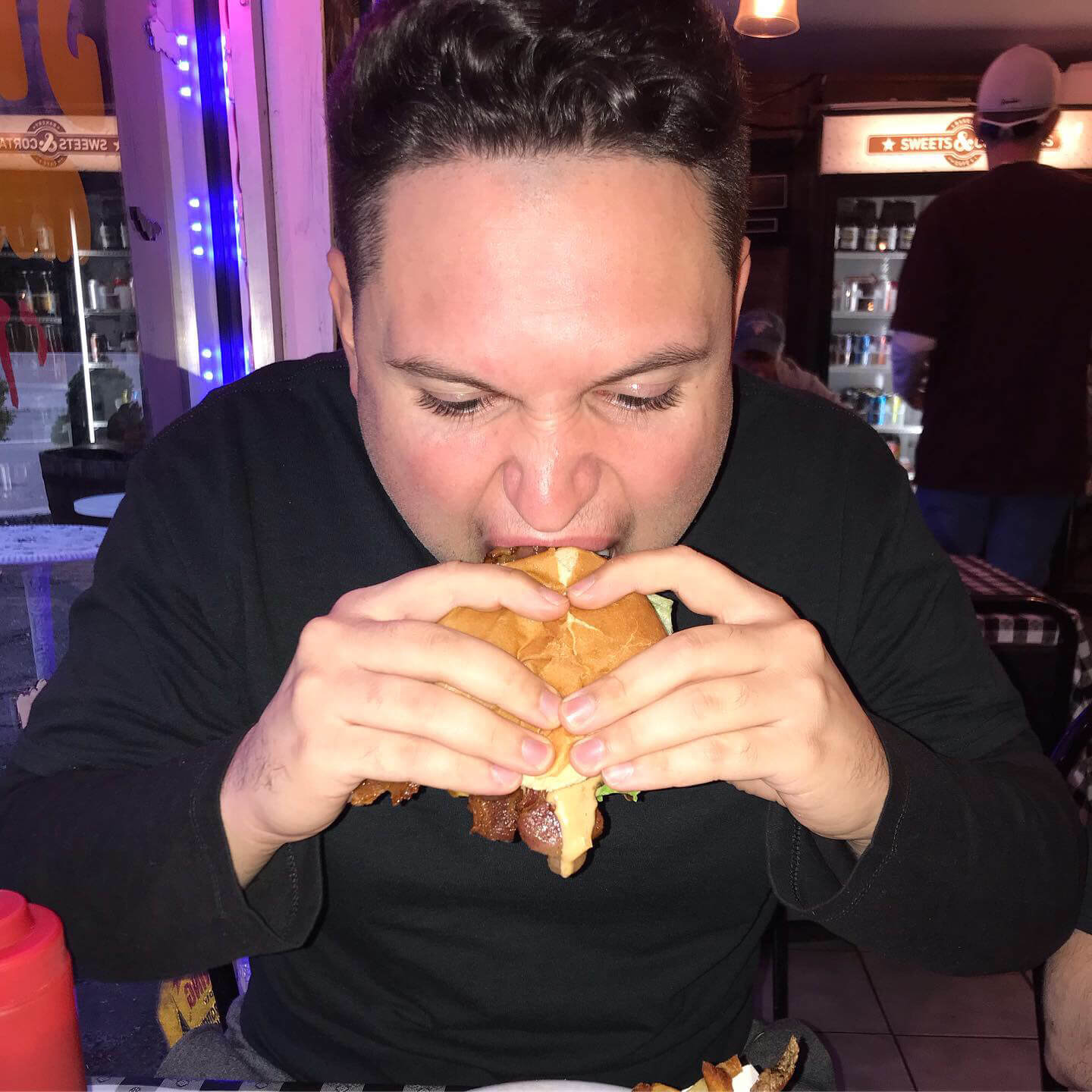 Marc DiPasquale eating a burger