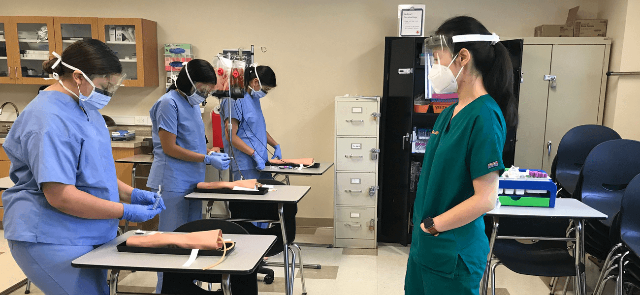 Healthcare Students wearing their medical scrubs and face masks.