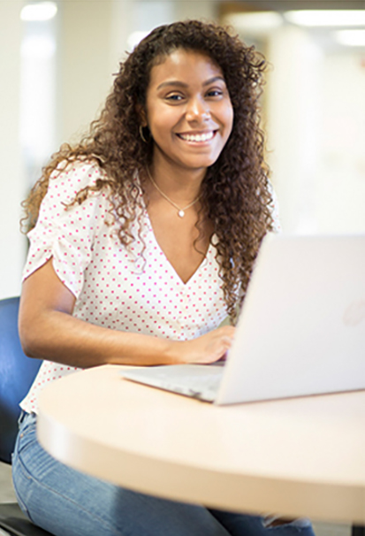 Photo of Berkeley College student on her laptop.