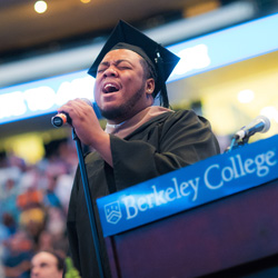 Amire Carter singing at commencement