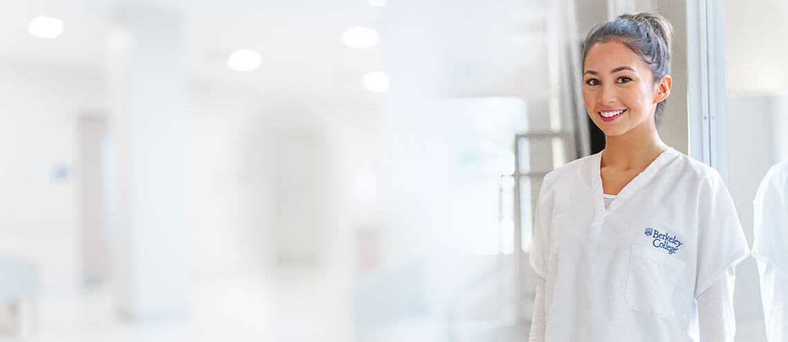 A woman in white scrubs