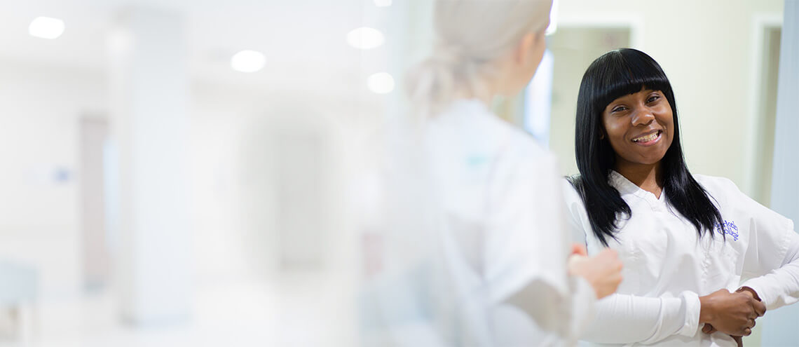 A female doctor smiling in a hospital