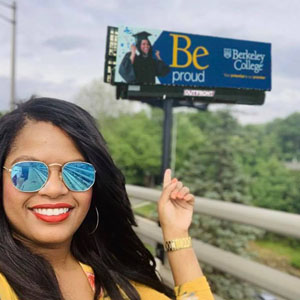 Mabel Eustaquio standing in front of Be Billboard