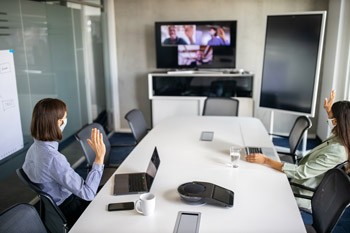 people in a zoom meeting at the office