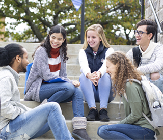 Group of students sitting on stairs at the Woodland Park Campus mobile image