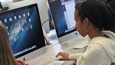 image of a girl in front of a computer