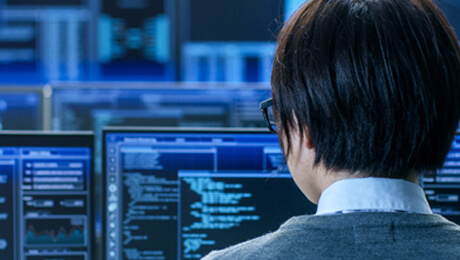 person on front of a computer