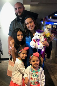 Jennifer Ruesta with family at Commencement