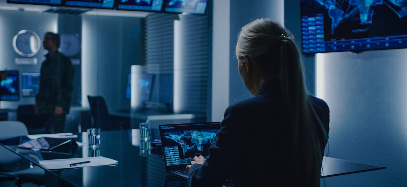 Female working on a computer in a national security office