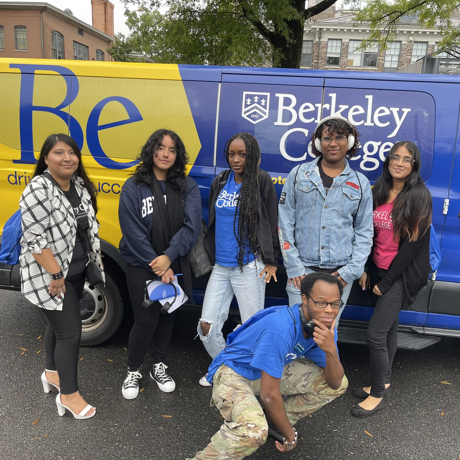 Students pose in front of the Berkeley College van