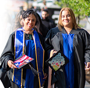 Two women in graduation attire