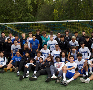 soccer players and coaches in action on the court, showcasing teamwork