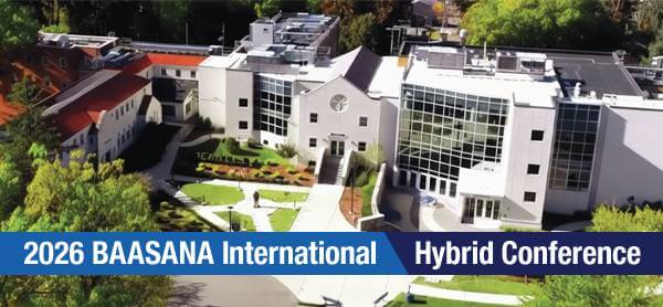 Aerial view of a modern conference center surrounded by trees on a sunny day. Banner text reads 2026 BAASANA International Hybrid Conference