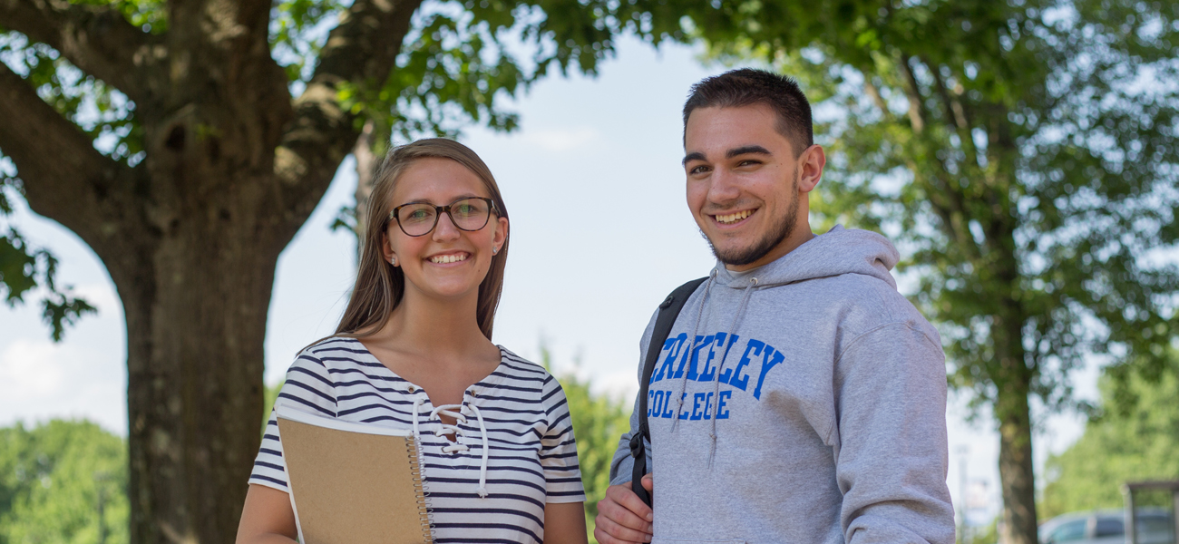 Male and female student outside 