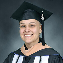 Photo of Vanessa Guzman  in graduation attire