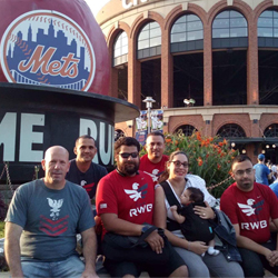 Veteran students at Mets game for check presentation