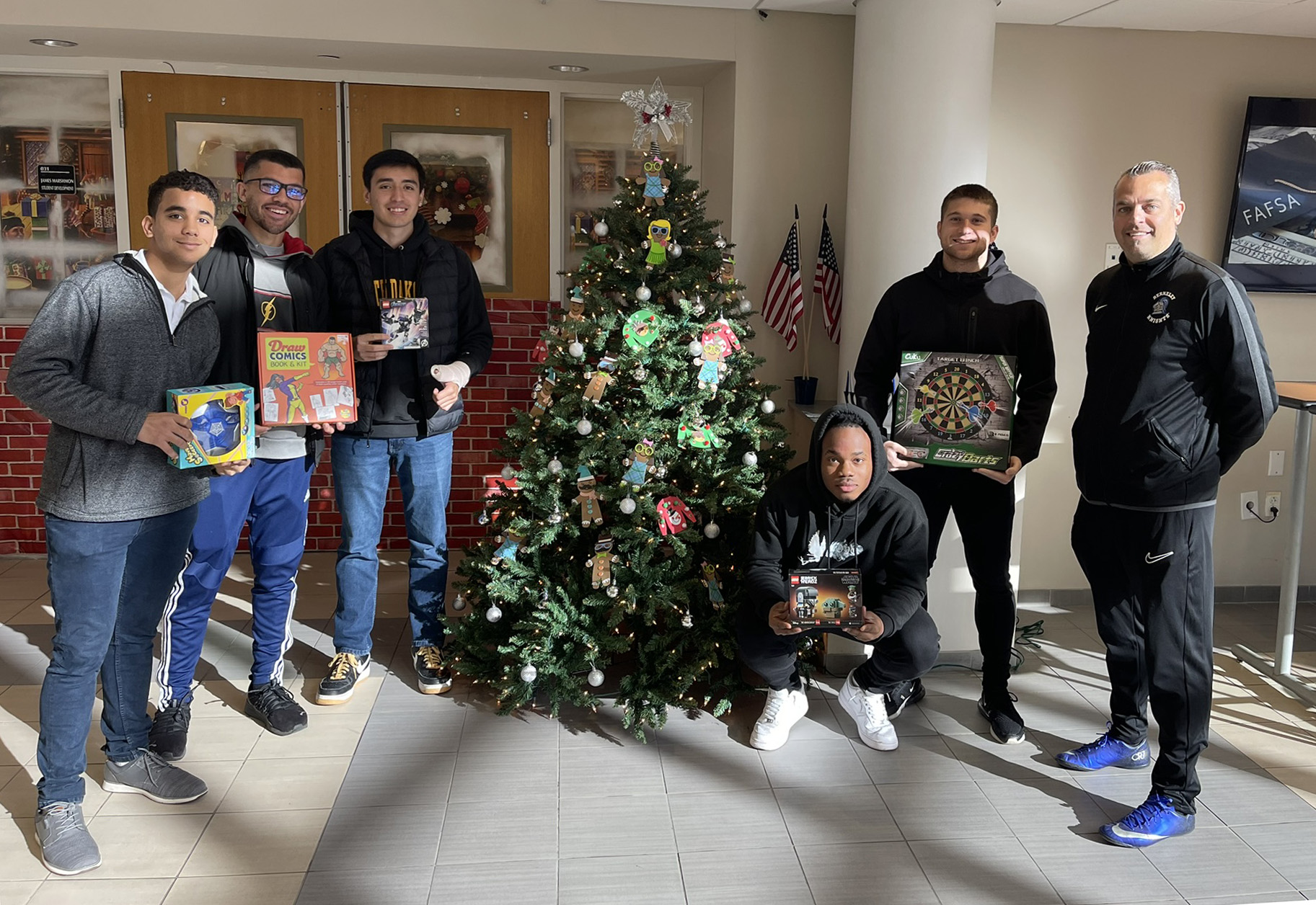 Student athletes with donated toys