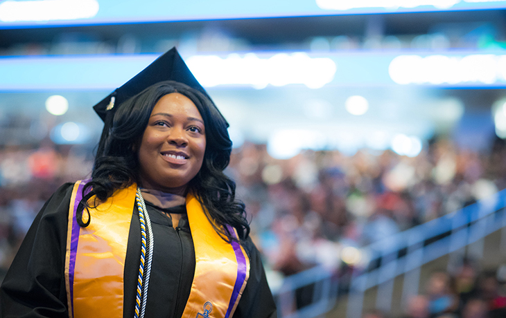 Berkeley College graduate in robes
