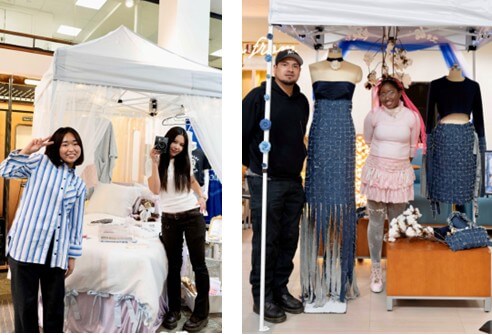 Left: Two students smile and stand in front of custom-made bedding they created; Right: Two students stand by denim attire they made for a competition.