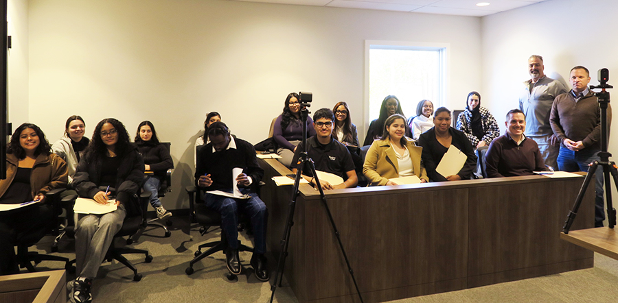 a group of people sit in a jury box