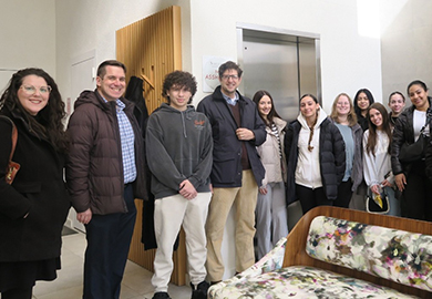 students pose at the furniture store
