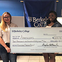 Students presenting check for Hurricane relief